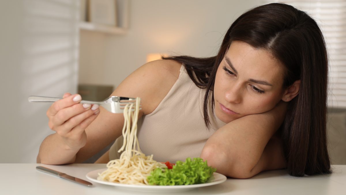 Woman displeased with her plate of food